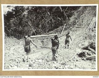 MILNE BAY, NEW GUINEA, 1943-07-12. MEMBERS OF THE 5TH AUSTRALIAN ARMY TROOP COMPANY, ROYAL AUSTRALIAN ENGINEERS AND THE 2/1ST AUSTRALIAN ENGINEERS AND THE 2/1ST AUSTRALIAN PIONEER BATTALION ..