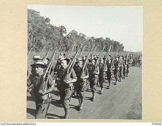 LAE, NEW GUINEA. 1944-10-07. A MARCH PAST OF THE 2/8TH COMMANDO SQUADRON. IDENTIFIED PERSONNEL ARE:- TROOPER D.G. LANGDON (1); TROOPER R. PATTEN (2); TROOPER W. STEVENSON (3); TROOPER E.C. BOYS ..