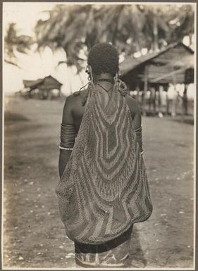 Girls from Village Wanigella [Wanigela], North Coast [A woman viewed from the back carrying a bilum] Frank Hurley