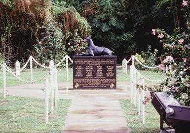 View of the Marine Corps war dog cemetery built in memory of the twenty-five combat trained dogs that lost their lives in the bitter fighting for the liberation of Guam. The dogs acted as sentries, messengers, and scouts along with searching for booby traps and anti-personnel mines. Twenty-four of the animals are buried here