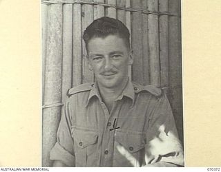 MILNE BAY, NEW GUINEA, 1944-01-11. VX58293 LANCE CORPORAL J.M. DORAN, DETACHMENT Z FIELD SECURITY SECTION, ATTACHED TO THE MILNE BAY BASE SUB AREA