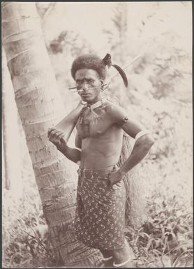 A guard holding a rifle in the village of Fiu, north-west Malaita, Solomon Islands, 1906 / J.W. Beattie