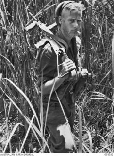 DUMPU, NEW GUINEA, 1943-10-07. A BEARDED NX130254 PRIVATE J.A. PRIOR OF THE 2/2ND AUSTRALIAN INDEPENDENT COMPANY ON HIS RETURN TO CAMP AFTER A 12 DAY PATROL IN THE RAMU VALLEY