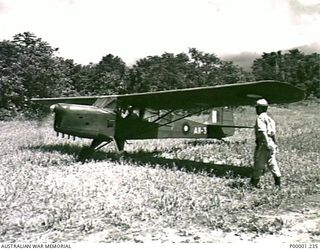 THE SOLOMON ISLANDS, 1945. ROYAL AUSTRALIAN AIR FORCE AUSTER AIRCRAFT (A11-3) ON A BUSH AIRSTRIP ON BOUGAINVILLE ISLAND. (RNZAF OFFICIAL PHOTOGRAPH.)