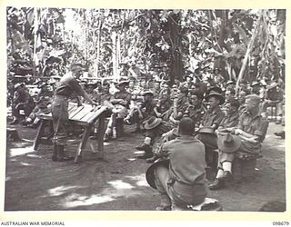 RABAUL, NEW BRITAIN. 1945-11-02. CAPTAIN PRATT, REHABILITATION OFFICER, STRESSES A POINT WHILE LECTURING TO AUSTRALIAN TROOPS WHO ARE RETURNING TO AUSTRALIA