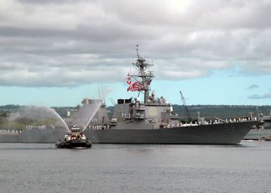 A tugboat conducts a water salute as the U.S. Navy Arleigh Burke Class Guided Missile Destroyer USS RUSSELL (DDG 59) returns to Naval Station Pearl Harbor, Hawaii, on Sept. 5, 2006, after a six-month deployment. RUSSELL departed this year as part of the Abraham Lincoln Carrier Strike Group and later joined the Kitty Hawk CSG before returning here at Pearl Harbor. (U.S. Navy photo by Mass Communication SPECIALIST 1ST Class James E. Foehl) (Released)