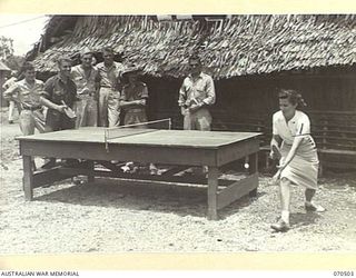 WARD'S DROME, PORT MORESBY AREA, PAPUA, 1944-02. AN AMERICAN RED CROSS HELPER, VIRGINIA RUGH, OF DECATUR, ILLINOIS, (1), PLAYING TABLE TENNIS WITH AN AUSTRALIAN SOLDIER AT THE AMERICAN RED CROSS ..