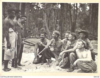 CAPE CUNNINGHAM, NEW BRITAIN, 1944-12-16. SEASONED 2/2 FORESTRY COY MEMBERS WHO SERVED IN ENGLAND AND SCOTLAND, ALONGSIDE NATIVE MEMBERS AT THEIR PRESENT MILL SITE. IDENTIFIED PERSONNEL ARE:- ..