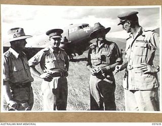 RAMU VALLEY, NEW GUINEA, 1943-10-01. SENIOR AIF. OFFICERS ARRIVED ON THE FIRST AIRCRAFT TO LAND ON THE NEW AIRSTRIP TO INSPECT THE COMPLETED AIRSTRIP. THEY ARE, LEFT TO RIGHT:- LIEUTENANT GENERAL ..