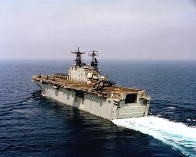 A port quarter view of the amphibious assault ship USS SAIPAN (LHA 2) underway during the NATO Southern Region exercise DRAGON HAMMER '90