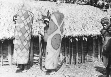 Highlands men with shields, Papua New Guinea, ca. 1930s / Michael Leahy