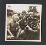 Crowd of men sitting on ground, Upper Ramu, Papua New Guinea, 1947