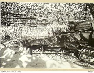 PORT MORESBY, NEW GUINEA. 1944-04-15. THE NO. 2 GUN, 155MM M1917 HEAVY ARTILLERY POSITIONED AT A GUN PIT OF THE BOERA HEAVY BATTERY. THE GUN PIT WAS CONSTRUCTED BY MEMBERS OF THE 8TH ARMY TROOPS ..