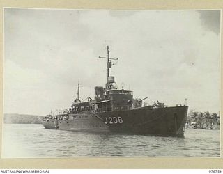 MADANG, NEW GUINEA. 1944-10-26. THE RAN CORVETTE, GYMPIE (J238) AT ANCHOR IN THE HARBOUR