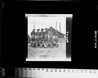 Wirui Beach, Wewak Area, New Guinea. 5 September 1945. Original members of 2/4 Infantry Battalion. Back row, left to right: NX5925 Private (Pte) A. J. Deloas of Cowra, NSW; NX5504 Pte K. R. Kable ..