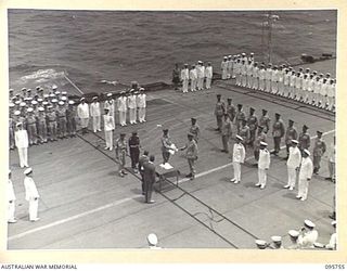 AT SEA OFF RABAUL, NEW BRITAIN. 1945-09-06. THE SURRENDER CEREMONY ON BOARD THE AIRCRAFT CARRIER HMS GLORY SHOWING LIEUTENANT GENERAL V.A.H. STURDEE, GENERAL OFFICER COMMANDING FIRST ARMY, ..