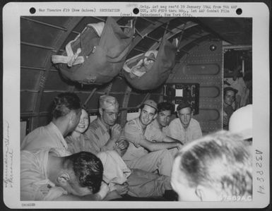 Gary Cooper and party aboard a Douglas C-47 enroute to Port Moresby, Papua, New Guinea from Milne Bay, New Guinea, during their tour of the Pacific Islands. 7 December 1943. (U.S. Air Force Number 67469AC)