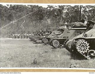 SOUTHPORT, QLD. 1944-01-18. MATILDA AND GENERAL GRANT TANKS OF THE 4TH ARMOURED BRIGADE FIRING SMALL CALIBRE WEAPONS DURING A DEMONSTRATION STAGED FOR A CONTINGENT OF NEW GUINEA POLICE BOYS WHO ARE ..