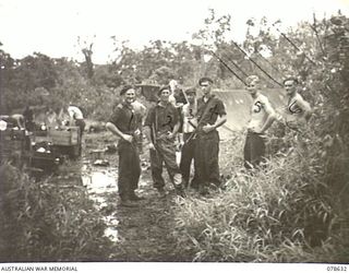 BOUGAINVILLE ISLAND. 1945-01-18. PERSONNEL OF THE 42ND INFANTRY BATTALION TAKING OVER THE AREA ADJACENT TO MAWARAKA VILLAGE FROM THE 47TH INFANTRY BATTALION. IDENTIFIED PERSONNEL ARE:- LANCE ..