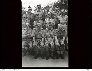 Port Moresby, New Guinea. 1944-06-01. Group portrait of members of HQ, 1 Water Transport Group (Small Craft), Royal Australian Engineers. Left to right: Back row: Sapper J. H. Harvey; Sergeant ..