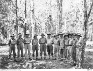 DOBODURA, NEW GUINEA. 1943-10-11. GROUP PORTRAIT OF OFFICERS OF HEADQUARTERS COMMAND, AUSTRALIAN ARMY SERVICE CORPS, 11TH AUSTRALIAN DIVISION. LEFT TO RIGHT:- VX90731 CAPTAIN A J T ARAM; NX111282 ..