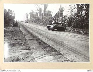 TOROKINA AREA, BOUGAINVILLE. 1945-07-23. M24 GENERAL CHAFFEE LIGHT TANKS TAKING PART IN SPEED TRIALS ON A STRAIGHT ROAD DURING TESTS FOR THE WAR OFFICE