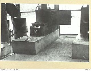BOUGAINVILLE ISLAND. 1945-02-22. A PRESSURE FUEL BURNER FITTED TO FOWLER STOVES IN OPERATION. THESE UNITS WERE DESIGN AND MADE BY PERSONNEL OF THE 113TH FIELD PARK WORKSHOPS, 3RD DIVISION