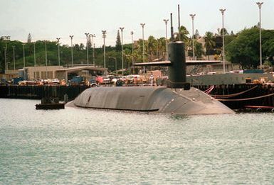 A starboard view of the nuclear-powered strategic missile submarine USS GEORGIA (SSBN-729) moored to a pier