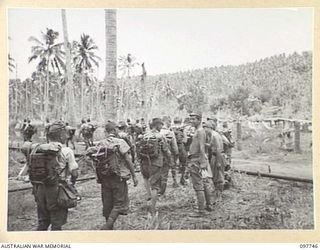 MUSCHU ISLAND, NEW GUINEA. 1945-10-10. FOLLOWING THE SURRENDER JAPANESE PERSONNEL WERE TRANSFERRED TO MUSCHU ISLAND. SHOWN, A COLUMN OF JAPANESE TROOPS, NEW ARRIVALS FROM THE BOIKEN AREA, MOVING UP ..