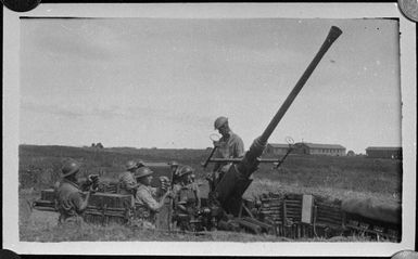 Bofors station at Nandi Airfield, Fiji, showing members of 27 Mixed Anti Aircraft Battery