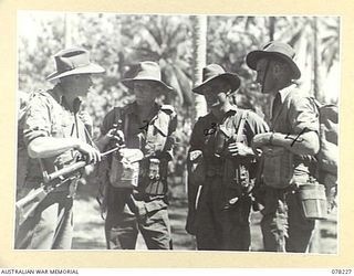 AITAPE, NEW GUINEA. 1945-01-06. PERSONNEL OF "JOCK FORCE", 2/2ND INFANTRY BATTALION PREPARING TO MOVE OUT FROM THE AUSTRALIAN AND NEW GUINEA ADMINISTRATION UNIT HEADQUARTERS AT THE START OF THEIR ..