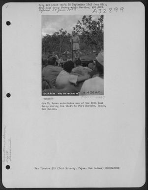 Joe E. Brown entertains men of the 38th Bomb Group during his visit to Port Moresby, Papua, New Guinea. (U.S. Air Force Number 91420AC)