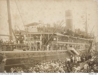 TOWNSVILLE, QLD, 1914-08-08. HMAT KANOWNA DRAWING AWAY FROM THE WHARF, TAKING THE FIRST AUSTRALIAN NAVY AND MILITARY EXPEDITIONARY FORCE (AN&MEF) TO GERMAN NEW GUINEA. A LARGE CROWD HAS GATHERED TO ..