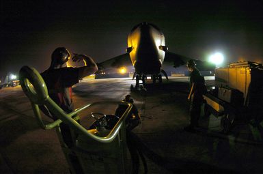 US Air Force (USAF) SENIOR AIRMAN (SRA) Kory McLeod (left), and SRA William Fay, both B-52 Stratofortress aircraft Crew Chiefs assigned to the 5th Bomb Wing (BW), prepare to launch their aircraft during night operations on the flight line at Andersen Air Force Base (AFB), Guam. (SUBSTANDARD)