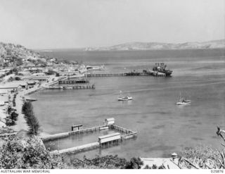 PORT MORESBY, PAPUA. 1942-07-11. GENERAL VIEW OF PORT MORESBY HARBOUR SHOWING SHIPPING FACILITIES AND PORTION OF THE TOWNSHIP