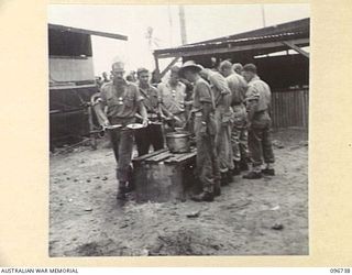 MOEM, WEWAK AREA, NEW GUINEA, 1945-09-17. MESS PARADE FOR 2/4 ARMOURED REGIMENT DETACHMENT WITH 4 INFANTRY TROOPS WORKSHOP