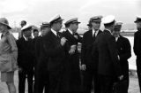 Guam, military officers gathered on pier