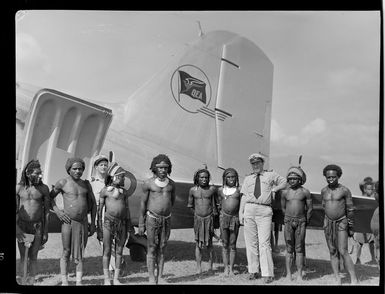 Qantas Empire Airways, Captain W Forgan-Smith and local people in traditional dress, Goroka, Eastern Highlands, Papua New Guinea