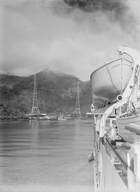 [Side view of a ship, and a Pacific island]