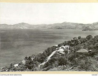 PAPUA. 1942-08-18. VIEW FROM KONEDOBU HILL LOOKING OUT OVER MORESBY HARBOUR TOWARDS FAIRFAX BAY, MACDHUI WRECK MAY BE SEEN IN THE LEFT DISTANCE ALONGSIDE ISLAND