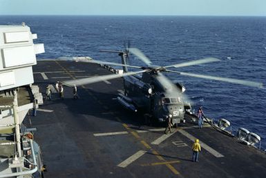 A CH-53 Sea Stallion helicopter lands on the flight deck of the amphibious assault ship USS GUAM (LPH 9) during flight operations off the coast of Beirut. The ship is providing support to US Marines deployed in Lebanon as part of a multi-national peacekeeping force following confrontation between Israeli forces and the Palestine Liberation Organization