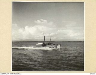 YULE ISLAND, NEW GUINEA. 1944-05-11/20. THE AM1939, A MOTOR VESSEL OF THE 1ST MARINE FOOD SUPPLY PLATOON COVERING THE 70 MILE JOURNEY BETWEEN PORT MORESBY AND THE ISLAND. TRAVELLING AT HALF SPEED, ..