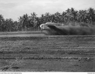 MILNE BAY, PAPUA. C. 1942-10. A BEAUFORT BOMBER AIRCRAFT OF NO. 100 SQUADRON RAAF SENDS UP A SPRAY OF MUD DURING TAKE-OFF FROM GURNEY AIRSTRIP