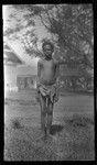 Boy with buildings in background