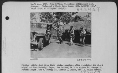 Fighter pilots dash from their living quarters after receiving the alert signal at Port Moresby, Papua, New Guinea, Left to right: Lt. George A. Parker; Major Jack W. Berry; Lt. Curran L. Jones, and Lt. Ralph Martin. (U.S. Air Force Number 25830AC)