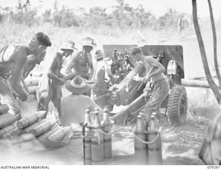 MELKONG RIVER, NEW BRITAIN. 1945-02-20. NO.2 GUN (25 POUNDER) OF THE 28TH BATTERY, 2/14TH FIELD REGIMENT, AT FULL RECOIL DURING A BOMBARDMENT OF THE JAPANESE POSITIONS IN THE WAITAVELO PLANTATION. ..