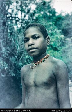 Mendi youth wearing beaded necklace