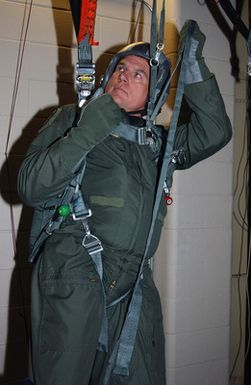 US Air Force (USAF) Major (MAJ) General (GEN) Mike DeCuir, Director of Air and Space Operations (ASO), Headquarters Air Combat Command (ACC), Langley Air Force Base (AFB), Virginia (VA), receives training on a parachute simulator at Barksdale Air Force Base's new B-52H Stratofortress egress trainer, in preparation for a flight to Andersen AFB, Guam (GU)