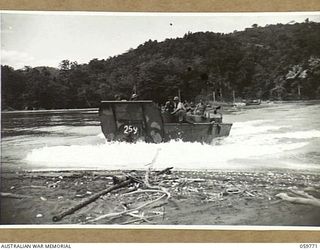 FINSCHHAFEN AREA, NEW GUINEA, 1943-10-25. THE BARGE FERRY SERVICE AT THE MOUTH OF THE MAPE RIVER ON LANGEMAK BAY