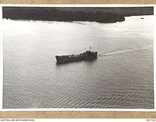 LANGEMAK BAY, NEW GUINEA. 1943-12-05. AN AMERICAN LST (LANDING SHIP, TANK) LEAVING LANGEMAK BAY